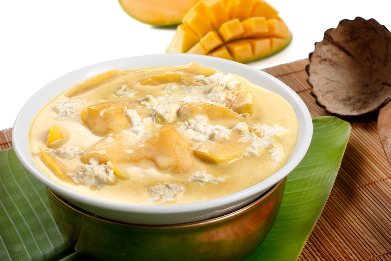 gallery-4 Creamy mango dessert served in a traditional bowl with distinct tropical flavors.